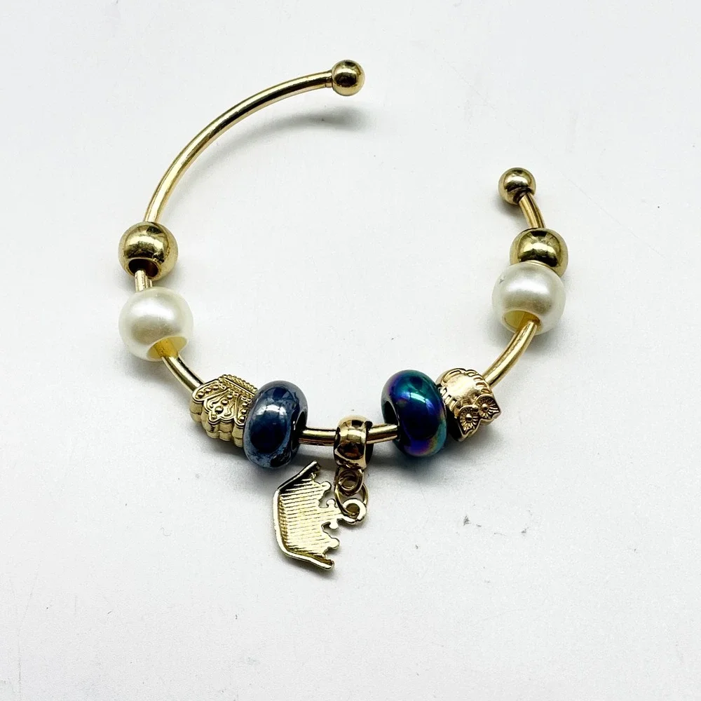 D'Bello Gold Tone Cuff Bracelet Blue Crystal Beads Crown Charm Adjustable NWT